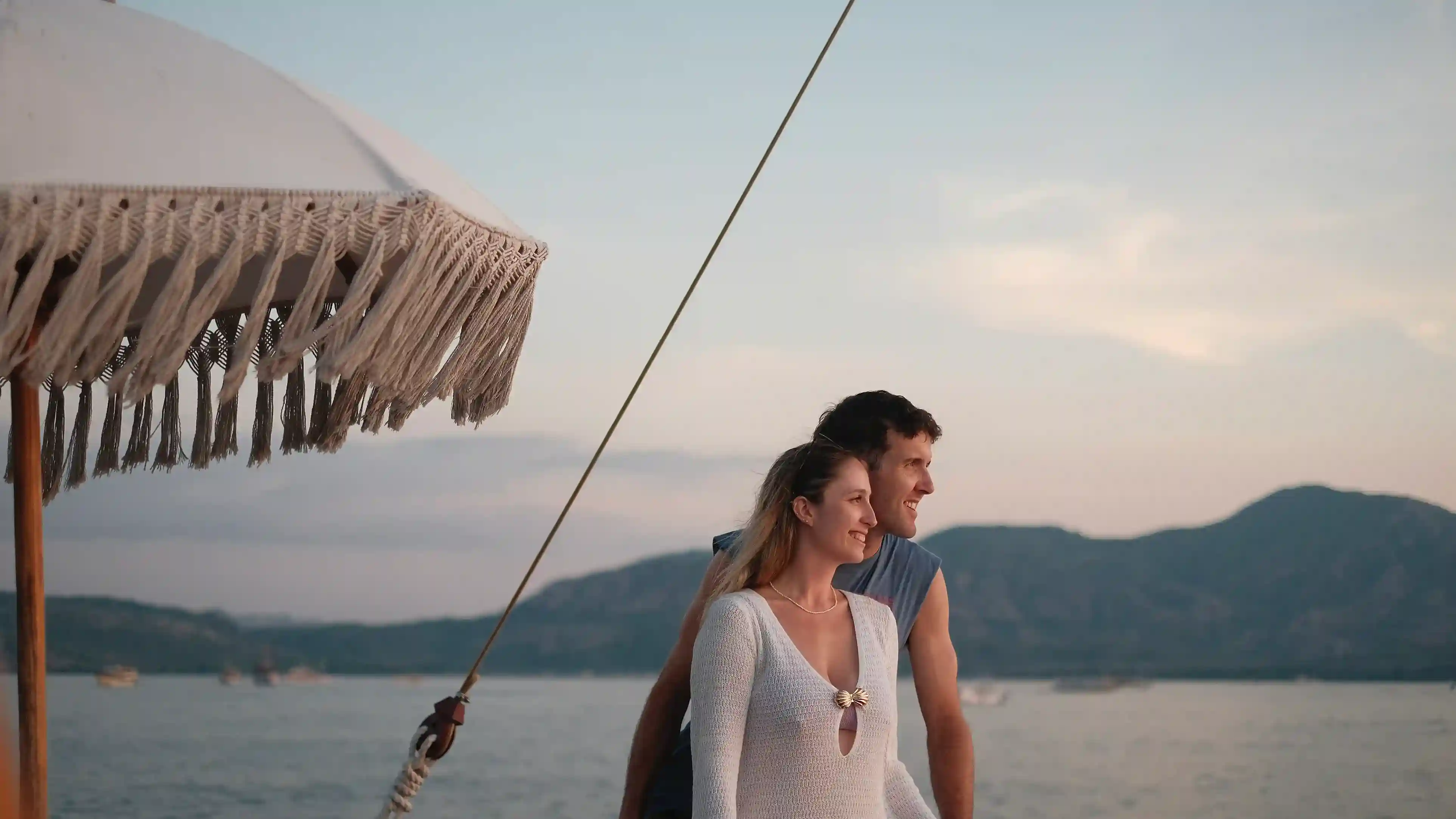 A couple watching the sunset from the deck