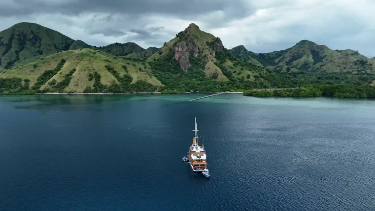 A phinisi under way in Komodo National Park
